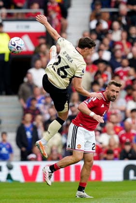Manchester, England, 30th August 2026. Dara O Shea of Ipswich Town tussles with Luke Shaw of Manchester United, ManU during the Manchester United vs Ipswich Town Premier League match at Old Trafford, Manchester. Picture credit should read: Andrew Yates Sportimage EDITORIAL USE ONLY. No use with unauthorised audio, video, data, fixture lists, club league logos or live services. Online in-match use limited to 120 images, no video emulation. No use in betting, games or single club league player publications. SPI_026_AY_Man_Utd_Ipswich SPI-4945-0026