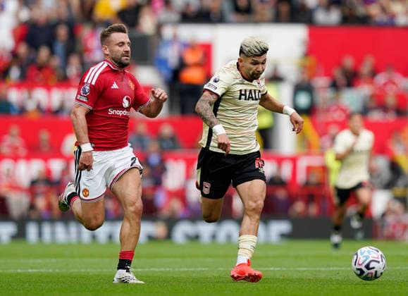 Manchester, England, 30th August 2026. Luke Shaw of Manchester United, ManU chases after Julio Enciso of Ipswich Town during the Manchester United vs Ipswich Town Premier League match at Old Trafford, Manchester. Picture credit should read: Andrew Yates Sportimage EDITORIAL USE ONLY. No use with unauthorised audio, video, data, fixture lists, club league logos or live services. Online in-match use limited to 120 images, no video emulation. No use in betting, games or single club league player publications. SPI_031_AY_Man_Utd_Ipswich SPI-4945-0031