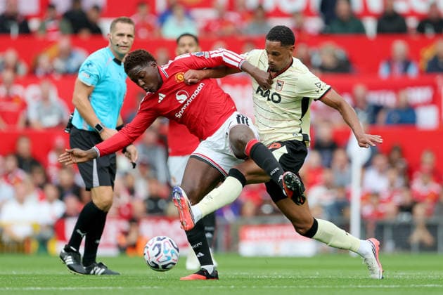 Manchester United, ManU v Ipswich Town - Premier League 2026 27 Kobbie Mainoo of Manchester United and Emersonn of Ipswich Town challenge during the Premier League 2026 27 match between Manchester United and Ipswich Town at Old Trafford on August 30, 2026 in Manchester, England. WARNING! This Photograph May Only Be Used For Newspaper And Or Magazine Editorial Purposes. May Not Be Used For Publications Involving 1 player, 1 Club Or 1 Competition Without Written Authorisation From Football DataCo Ltd. For Any Queries, Please Contact Football DataCo Ltd on +44 (0) 207 864 9121 Manchester Old Trafford England United Kingdom Copyright: xAllstarxPicturexLibraryxLtdx