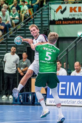 OPEL Handball Bundesliga; HSG Wetzlar - SG BBM Bietigheim, 30.08.26 Mathias Larson (SG BBM Bietigheim, 44), Tristan Kirschner (HSG Wetzlar, 5) OPEL Handball Bundesliga; HSG Wetzlar - SG BBM Bietigheim: Wetzlar, 30.08.26 Copyright: xBEAUTIFULxSPORTS Roeczeyx