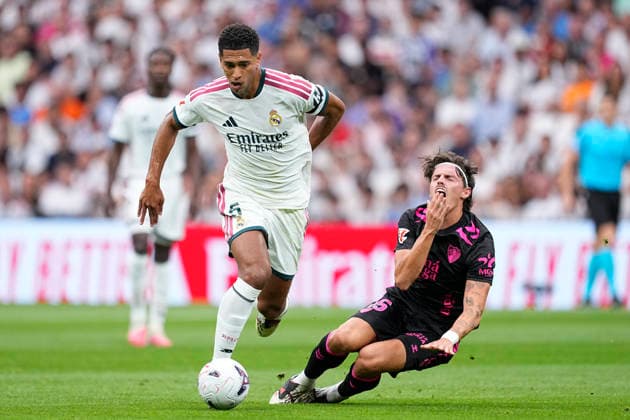 August 30, 2026, Madrid, Madrid, Spain: Jude Bellingham of Real Madrid CF and Angel Recio of Malaga CF in action during the Spanish League, LaLiga EA Sports, football match played between Real Madrid and Malaga CF at Bernabeu stadium on August 30, 2026, in Madrid, Spain. Madrid Spain - ZUMAa181 20260830_zaa_a181_086 Copyright: xOscarxJ.xBarrosox