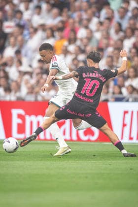 MADRID, SPAIN - AUGUST 30: Kylian Mbappe of Real Madrid (L) runs with the ball under pressure from David Larrubia of Malaga (R) during the LaLiga EA Sports football match between Real Madrid and Malaga at Estadio Santiago Bernabeu on August 30, 2026 in Madrid, Spain. (Photo by Ricardo Nogueira Sports Press Photo) Copyright: xRicardoxNogueira SportsxPressxPhotox Sportspressphoto_SPR219894