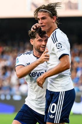 Martin Baturina of Como 1907 celebrates with Nico Paz after scoring the goal of 0-1 during the Serie A 2025 2026 football match between SSC Napoli and Como 1907 at Diego Armando Maradona stadium in Naples (Italy), August 30, 2026. AndreaxStaccioli