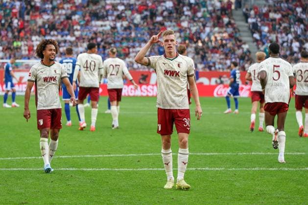 Anton Kade 30 (FC Augsburg) jubelt ueber sein Tor zum 2:0, mit Han-Noah Massengo 4 FC Augsburg), FC Augsburg vs. FC Schalke 04, Fussball, Maenner, Bundesliga, Saison 2026 2027, Hinrunde, 1. Spieltag, 30.08.2026 DFB regulations prohibit any use of photographs as image sequences and or quasi-video Augsburg Bayern Deutschland *** Anton Kade (30, FC Augsburg) celebrates his goal to make it 2–0, with Han Noah Massengo (4, FC Augsburg); FC Augsburg vs. FC Schalke 04; soccer; men s; Bundesliga; 2026–2027 season; First Half of the Season, Matchday 1, August 30, 2026. DFB regulations prohibit any use of photographs as image sequences and or quasi-video. Augsburg, Bavaria, Germany Copyright: xkolbert-press MartinxAgüerax