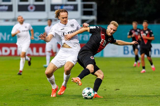 KOELN, GERMANY - AUGUST 30, 2026: Rico Preißinger (Preußen Münster, 21) and Meiko Sponsel (FC Viktoria Köln, 19) during the 3rd division match on gameday 3 between Viktoria Koeln vs. Preußen Muenster at the Sportpark Hoehenberg on August 30, 2026 in Koeln, Germany. DFL REGULATIONS PROHIBIT ANY USE OF PHOTOGRAPHS AS IMAGE SEQUENCES AND OR QUASI-VIDEO. Nordrhein-Westfalen Germany Copyright: xLeahxKohringx