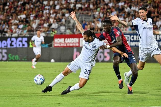 IPA87947450 - Hakan Calhanoglu of Inter and Paul Mendy of Cagliari Calcio during the Cagliari Calcio vs. Inter - FC Internazionale Italian Serie A soccer match in Cagliari, Italy, on August 30, 2026  Copyright: xLuigixCanu IPAxSportx xx 87947450