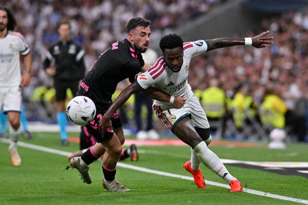 August 30, 2026, Madrid, Madrid, Spain: 7 VINICIUS JUNIOR of Real Madrid CF and CARLOS PUGA of Malaga CF disputes a ball during the match on Matchday 3 of the 2026-27 National League First Division Championship between REAL MADRID C.F. and MALAGA CF, played at the Bernabeu Stadium on August 30, 2026, in Madrid, Spain. Madrid Spain - ZUMAc312 20260830_zsp_c312_224 Copyright: xOscarxManuelxSanchezx