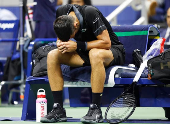 Novak Djokovic of Serbia reacts during a changeover in the first set of his match against Mariano Navone of Argentina in Arthur Ashe Stadium in the first round at the 2026 US Open Tennis Championship at the USTA Billie Jean King National Tennis Center in New York City on Sunday, August 30, 2026.  NYP20260830136 JOHNxANGELILLO