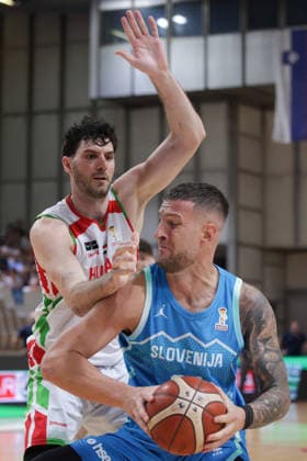 (260831) -- LJUBLJANA, Aug. 31, 2026 -- Alen Omic (front) of Slovenia vies with Gyorgy Goloman of Hungary during the men s FIBA Basketball World Cup 2027 European Qualifiers match between Slovenia and Hungary at Tivoli Sports Hall in Ljubljana, Slovenia, Aug. 30, 2026. (Photo by Xinhua) (SP)SLOVENIA-LJUBLJANA-BASKETBALL-WORLD CUP 2027 EUROPEAN QUALIFIERS-SLOVENIA VS HUNGARY ZeljkoxStevanic 