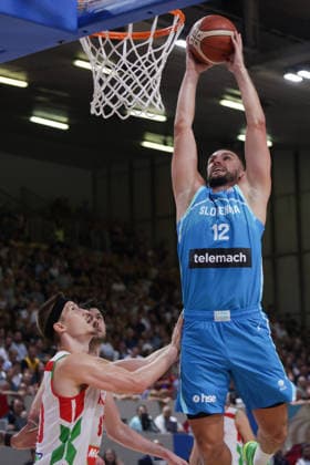 (260831) -- LJUBLJANA, Aug. 31, 2026 -- Rok Radovic (top) of Slovenia goes for a dunk during the men s FIBA Basketball World Cup 2027 European Qualifiers match between Slovenia and Hungary at Tivoli Sports Hall in Ljubljana, Slovenia, Aug. 30, 2026. (Photo by Xinhua) (SP)SLOVENIA-LJUBLJANA-BASKETBALL-WORLD CUP 2027 EUROPEAN QUALIFIERS-SLOVENIA VS HUNGARY ZeljkoxStevanic 