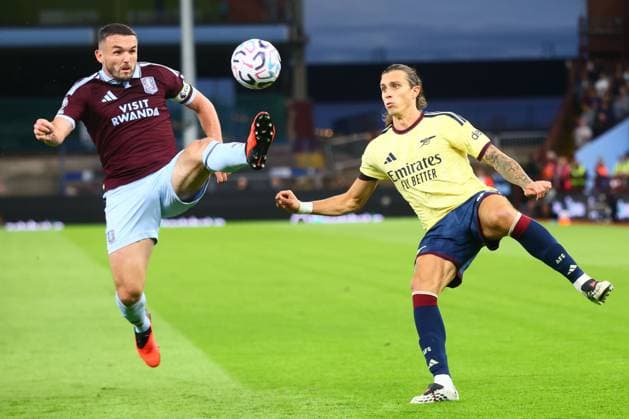 John McGinn of Aston Villa and Riccardo Calafiori of Arsenal Aston Villa v Arsenal, Premier League Football, Football, Villa Park, Birmingham, UK - 31 Aug 2026Birmingham Villa Park United Kingdom EDITORIAL USE ONLY No use with unauthorised audio, video, data, fixture lists, club league logos or live services. Online in-match use limited to 120 images, no video emulation. No use in betting, games or single club league player publications. Copyright: xPaulxCurrie Shutterstockx 17126356m