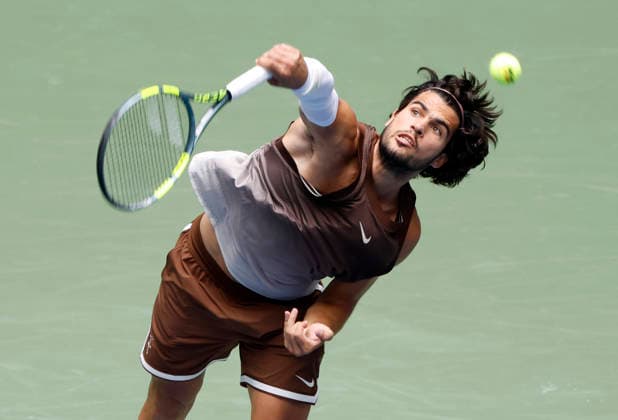 Carlos Alcaraz of Spain serves in the first set of his first round match against Roman Safiullin in Arthur Ashe Stadium at the 2026 US Open Tennis Championship at the USTA Billie Jean King National Tennis Center in New York City on Monday, August 31, 2026. Alcaraz defeated Safiullin in straight sets to advance to the second round.  NYP20260831110 JOHNxANGELILLO