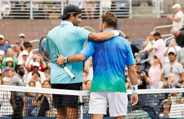 Stan Wawrinka of Switzerland and Matteo Berrettini meet at net after match point in their first round match in The Grandstand at the 2026 US Open Tennis Championship at the USTA Billie Jean King National Tennis Center in New York City on Monday, August 31, 2026. Stan Wawrinka ended his Grand Slam career with his loss to Berrettini in straight sets.  NYP20260831117 JOHNxANGELILLO