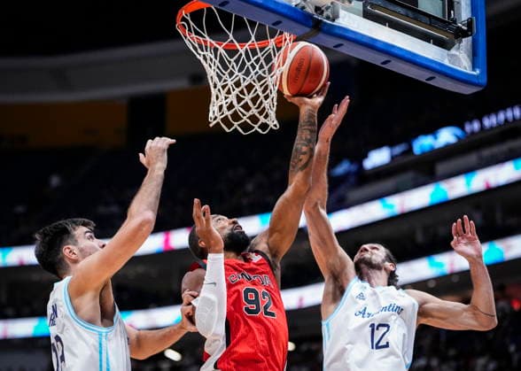 August 31, 2026, Quebec City, Pq, Canada: Canada s Khem Birch (92) goes to the net under pressure from Argentina s Gonzalo Bressan (18) and teammate Leandro Bolmaro (12) during their FIBA world cup qualification action in Quebec City, Monday, Aug.Ã‚ 31, 2026. Khem Birch (92) Leandro Bolmaro (12)  - ZUMAc35_ 20260831_zaf_c35_080 Copyright: xMathieuxBelangerx