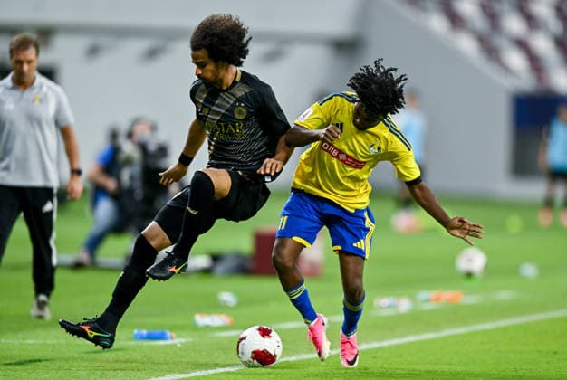 QATAR CUP 2026 SEMI-FINAL MATCH AL-SADD SC AND AL-GHARAFA SC Akram Hassan Afif (L) of Al Sadd SC and Amro Abdelfatah Surag of Al-Gharafa SC compete during the Qatar Cup 2026 semi-final match between Al-Sadd SC and Al-Gharafa SC at Khalifa International Stadium in Doha, Qatar, on September 1, 2026. DOHA Qatar Copyright: xNOUSHADx