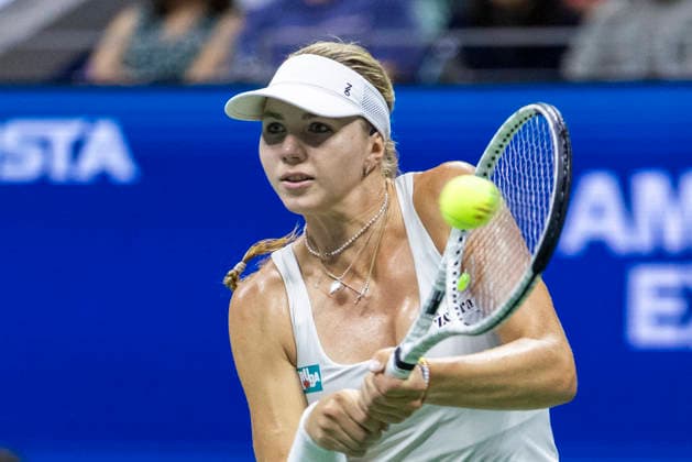 Polina Iatcenko of Russia returns a ball to to Aryna Sabalenka of Belarus in the second set of their second round match in Arthur Ashe Stadium at the 2026 US Open Tennis Championships at the USTA Billie Jean King National Tennis Center in New York City on Wednesday, September 2, 2026.  NYP20260902314 COREYxSIPKIN