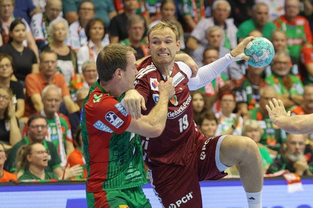 03.09.2026, xtgx, Handball Opel HBL, SC Magdeburg - Füchse Berlin emspor, v.l. Felix Claar (Magdeburg, 7) Mathias Gidsel (Berlin, 19) Zweikampf, Duell, Kampf, tackle Magdeburg