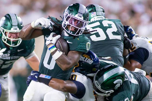 September 5, 2026, East Lansing, Michigan, U.S: Michigan State running back CAM EDWARDS (0) carries the ball during Michigan State s 30-20 win over Toledo at Spartan Stadium. NCAA, College League, USA Football 2026: Michigan State 30:20 Toledo  - ZUMAm242 20260905_aap_m242_006 Copyright: xScottxMapesx
