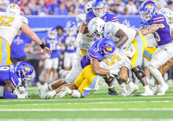 Sep 4, 2026: Kansas Jayhawks linebacker Quincy Davis (13) tackles Long Island Sharks running back Nasir Hennigan (25) in Lawrence, KS, USA; at Memorial Stadium. Mandatory Credit: -Cal Media NCAA, College League, USA Football 2026: LIU Vs Kansas SEP 04  - ZUMAc04_ 20260904_zma_c04_044 Copyright: xRomanxPunox