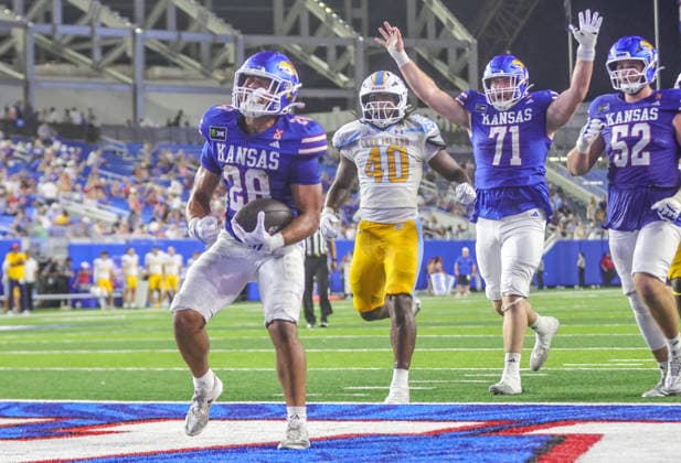 NCAA, College League, USA Football 2026: LIU Vs Kansas SEP 04 Sep 4, 2026: Kansas running back Micah Johnson scores a touchdown against Long Island Sharks in Lawrence, KS, USA; at Memorial Stadium. Mandatory Credit: Roman Puno-Cal Media (Credit Image: Â Roman Puno Cal Sport Media) Lawrence Ks USA EDITORIAL USE ONLY Copyright: xx ZUMA-20260904_zma_c04_078.jpg RomanxPunox csmphotothree517096
