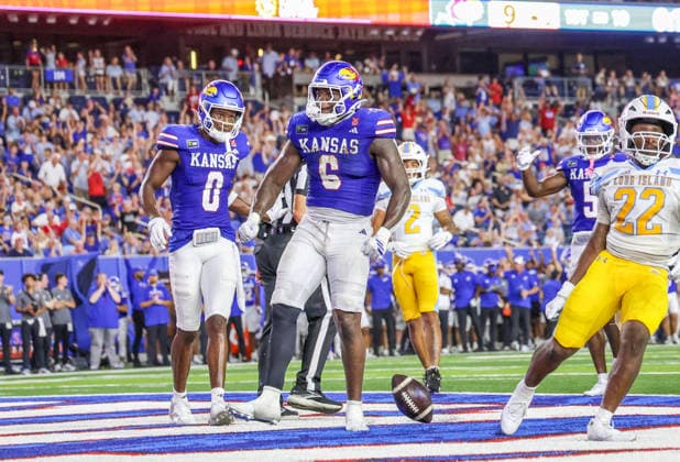 Sep 4, 2026: Kansas Jayhawks running back Yasin Willis (6) breaks a tackle and scores a touchdown against Long Island Sharks in Lawrence, KS, USA; at Memorial Stadium. Mandatory Credit: -Cal Media Lawrence USA - ZUMAc04_ 20260904_zma_c04_050 Copyright: xRomanxPunox