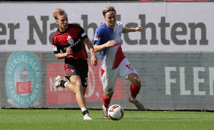 Duell zwischen Jonas Therkelsen (Holstein Kiel) und Tim Janisch (1.FC Nuernberg) Fussball, Herren, Saison 2026 2027, 2.BL, Holstein Stadion, Holstein Kiel gegen 1.FC Nuernberg DFL REGULATIONS PROHIBIT ANY USE OF PHOTOGRAPHS AS IMAGE SEQUENCES AND OR QUASI-VIDEO. *** Head-to-head between Jonas Therkelsen (Holstein Kiel) and Tim Janisch (1. FC Nuremberg) – Men s Soccer, 2026–2027 Season, 2. Bundesliga, Holstein Stadium, Holstein Kiel vs. 1. FC Nuremberg. DFL regulations prohibit any use of photographs as image sequences and or quasi-video.