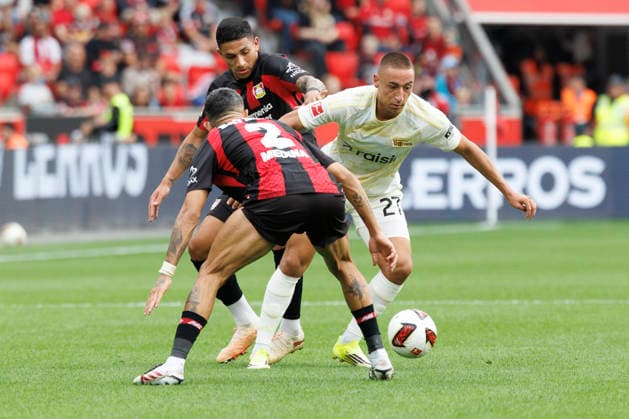 LEVERKUSEN, GERMANY - SEPTEMBER 5, 2026: Marin Ljubicic (1. FC Union Berlin, 27), Facundo Medina (Bayer 04 Leverkusen, 2) tackling during the German Bundesliga match on gameday 2 between Bayer 04 Leverkusen vs. 1. FC Union Berlin at BayArena on September 5, 2026 in Leverkusen, Germany. DFL REGULATIONS PROHIBIT ANY USE OF PHOTOGRAPHS AS IMAGE SEQUENCES AND OR QUASI-VIDEO. Northrhine-Westphalia Germany Copyright: xAxelxKohringx