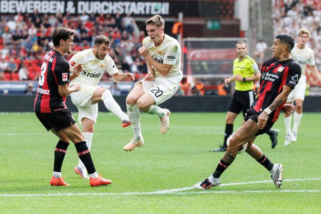 LEVERKUSEN, GERMANY - SEPTEMBER 5, 2026: Josip Juranovi c (1. FC Union Berlin, 18) shoots, Michel Aebischer (1. FC Union Berlin, 20) jumps, Miguel Gutiérrez (Bayer 04 Leverkusen, 3) and Facundo Medina (Bayer 04 Leverkusen, 2) tries to block during the German Bundesliga match on gameday 2 between Bayer 04 Leverkusen vs. 1. FC Union Berlin at BayArena on September 5, 2026 in Leverkusen, Germany. DFL REGULATIONS PROHIBIT ANY USE OF PHOTOGRAPHS AS IMAGE SEQUENCES AND OR QUASI-VIDEO. Northrhine-Westphalia Germany Copyright: xAxelxKohringx