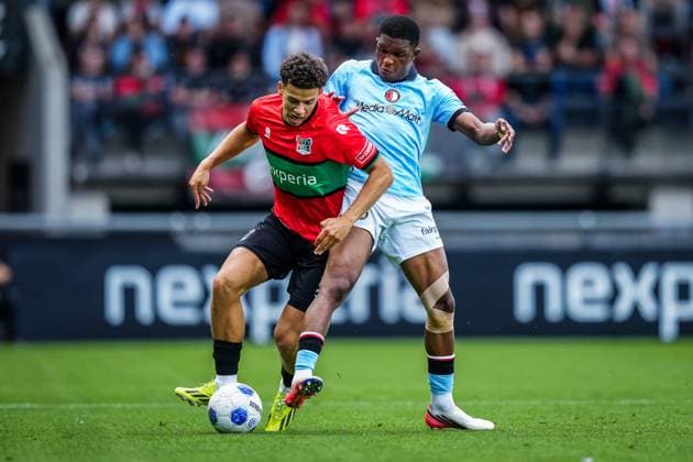 NIJMEGEN , 05-09-2026 , Stadium De Goffert , season 2026 2027 , Dutch Eredivisie football , match between NEC Nijmegen and Feyenoord Rotterdam , picture shows NEC Nijmegen player Clement Bischoff and Feyenoord player Givairo Read NEC - Feyenoord  x206499973x Copyright: