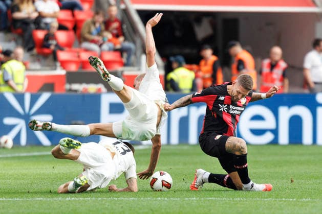LEVERKUSEN, GERMANY - SEPTEMBER 5, 2026: András Schäfer (1. FC Union Berlin, 13), Tom Alexander Rothe (1. FC Union Berlin, 15), Robert Andrich (Bayer 04 Leverkusen, 8) tackling during the German Bundesliga match on gameday 2 between Bayer 04 Leverkusen vs. 1. FC Union Berlin at BayArena on September 5, 2026 in Leverkusen, Germany. DFL REGULATIONS PROHIBIT ANY USE OF PHOTOGRAPHS AS IMAGE SEQUENCES AND OR QUASI-VIDEO. Northrhine-Westphalia Germany Copyright: xAxelxKohringx