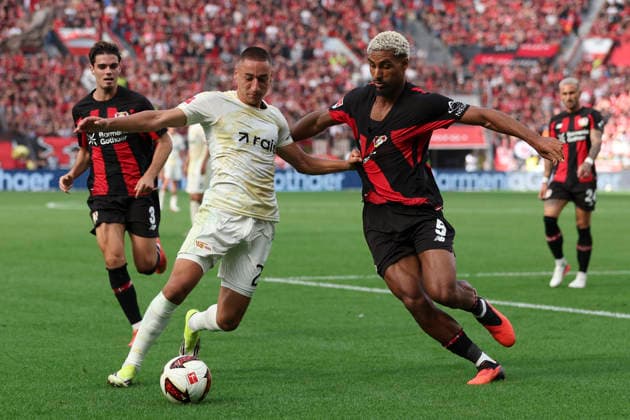 Marin Ljubicic (1.FC Union Berlin) und Loic Bade (Bayer 04 Leverkusen) im Zweikampf waehrend des Spiels der 1. Bundesliga zwischen Bayer 04 Leverkusen und 1. FC Union Berlin, BayArena am 05. September 2026 in Leverkusen, Deutschland. (Foto von Oliver Kaelke DeFodi Images) +++ Marin Ljubicic (1.FC Union Berlin) und Loic Bade (Bayer 04 Leverkusen) battle for the ball during the Bundesliga match between Bayer 04 Leverkusen and 1. FC Union Berlin at BayArena on September 5, 2026 in Leverkusen, Germany. (Photo by Oliver Kaelke DeFodi Images) DFB DFL REGULATIONS PROHIBIT ANY USE OF PHOTOGRAPHS AS IMAGE SEQUENCES AND OR QUASI-VIDEO. (Photo by Oliver Kaelke DeFodi Images) - *** Marin Ljubicic of 1 FC Union Berlin and Loic Bade of Bayer 04 Leverkusen battle for the ball during the Bundesliga match between Bayer 04 Leverkusen and 1 FC Union Berlin at the BayArena on September 5, 2026, in Leverkusen, Germany. Photo by Oliver Kaelke, DeFodi Images. Marin Ljubicic of 1. FC Union Berlin and Loic Bade of Bayer 04 Leverkusen battle for the ball during the Bundesliga match between Bayer 04 Leverkusen and 1. FC Union Berlin at BayArena on September 5, 2026 in Leverkusen, Germany. Photo by Oliver Kaelke, DeFodi Images. DFB and DFL regulations prohibit any use of photographs as image sequences and or quasi-video. Photo by Oliver Kaelke, DeFodi Images.