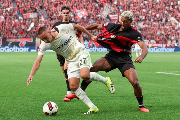 Marin Ljubicic (1.FC Union Berlin) und Loic Bade (Bayer 04 Leverkusen) im Zweikampf waehrend des Spiels der 1. Bundesliga zwischen Bayer 04 Leverkusen und 1. FC Union Berlin, BayArena am 05. September 2026 in Leverkusen, Deutschland. (Foto von Oliver Kaelke DeFodi Images) +++ Marin Ljubicic (1.FC Union Berlin) und Loic Bade (Bayer 04 Leverkusen) battle for the ball during the Bundesliga match between Bayer 04 Leverkusen and 1. FC Union Berlin at BayArena on September 5, 2026 in Leverkusen, Germany. (Photo by Oliver Kaelke DeFodi Images) DFB DFL REGULATIONS PROHIBIT ANY USE OF PHOTOGRAPHS AS IMAGE SEQUENCES AND OR QUASI-VIDEO. (Photo by Oliver Kaelke DeFodi Images) - *** Marin Ljubicic of 1 FC Union Berlin and Loic Bade of Bayer 04 Leverkusen battle for the ball during the Bundesliga match between Bayer 04 Leverkusen and 1 FC Union Berlin at the BayArena on September 5, 2026, in Leverkusen, Germany. Photo by Oliver Kaelke, DeFodi Images. Marin Ljubicic of 1. FC Union Berlin and Loic Bade of Bayer 04 Leverkusen battle for the ball during the Bundesliga match between Bayer 04 Leverkusen and 1. FC Union Berlin at BayArena on September 5, 2026 in Leverkusen, Germany. Photo by Oliver Kaelke, DeFodi Images. DFB and DFL regulations prohibit any use of photographs as image sequences and or quasi-video. Photo by Oliver Kaelke, DeFodi Images.