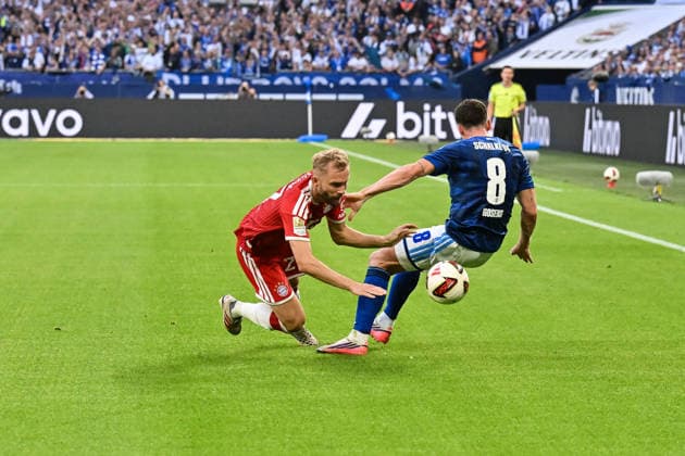 GELSENKIRCHEN, GERMANY; 05. SEPTEMBER: tackle between Konrad LAIMER (FC Bayern Munich 27) and Robin GOSENS (FC Schalke 8) during the Bundesliga Match between FC Schalke 04 vs. FC Bayern Munich at Matchday 2 at Veltins Arena DFL REGULATIONS PROHIBIT ANY USE OF PHOTOGRAPHS AS IMAGE SEQUENCES AND OR QUASI-VIDEO Copyright: xBEAUTIFULxSPORTS Goldbergx