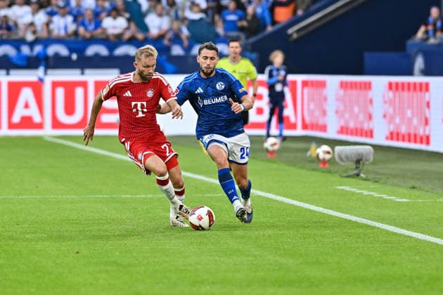 GELSENKIRCHEN, GERMANY; 05. SEPTEMBER: tackle between Konrad LAIMER (FC Bayern Munich 27) and Adil AOUCHICHE (FC Schalke 24) during the Bundesliga Match between FC Schalke 04 vs. FC Bayern Munich at Matchday 2 at Veltins Arena DFL REGULATIONS PROHIBIT ANY USE OF PHOTOGRAPHS AS IMAGE SEQUENCES AND OR QUASI-VIDEO Copyright: xBEAUTIFULxSPORTS Goldbergx