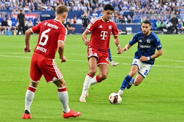 GELSENKIRCHEN, GERMANY; 05. SEPTEMBER: tackle between Aleksandar PAVLOVIC (FC Bayern Munich 45) and Adil AOUCHICHE (FC Schalke 24) during the Bundesliga Match between FC Schalke 04 vs. FC Bayern Munich at Matchday 2 at Veltins Arena DFL REGULATIONS PROHIBIT ANY USE OF PHOTOGRAPHS AS IMAGE SEQUENCES AND OR QUASI-VIDEO Copyright: xBEAUTIFULxSPORTS Goldbergx