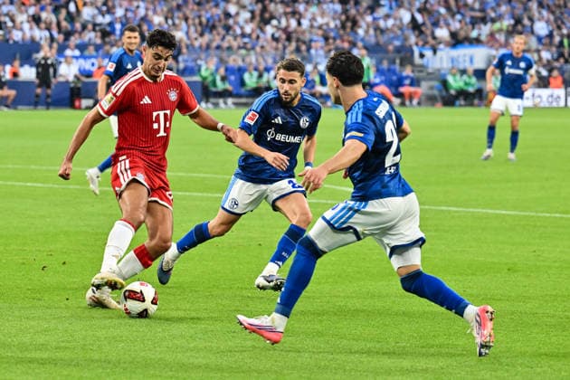 GELSENKIRCHEN, GERMANY; 05. SEPTEMBER: tackle between Aleksandar PAVLOVIC (FC Bayern Munich 45) and Adil AOUCHICHE (FC Schalke 24) and Soufiane EL-FAOUZI (FC Schalke 23) during the Bundesliga Match between FC Schalke 04 vs. FC Bayern Munich at Matchday 2 at Veltins Arena DFL REGULATIONS PROHIBIT ANY USE OF PHOTOGRAPHS AS IMAGE SEQUENCES AND OR QUASI-VIDEO Copyright: xBEAUTIFULxSPORTS Goldbergx