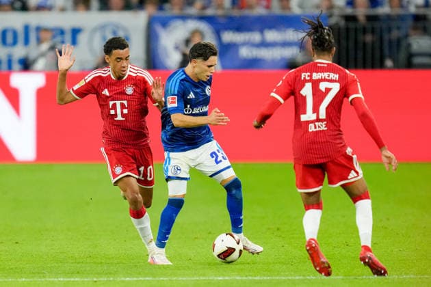 Jamal Musiala (FC Bayern Muenchen) und Soufiane El-Faouzi (FC Schalke 04) im Zweikampf waehrend des Spiels der 1. Bundesliga zwischen FC Schalke 04 und FC Bayern Muenchen, Veltins-Arena am 05. September 2026 in Gelsenkirchen, Deutschland. (Foto von Alex Gottschalk DeFodi Images) +++ Jamal Musiala (FC Bayern Muenchen) und Soufiane El-Faouzi (FC Schalke 04) battle for the ball during the Bundesliga match between FC Schalke 04 and FC Bayern Muenchen at Veltins-Arena on September 5, 2026 in Gelsenkirchen, Germany. (Photo by Alex Gottschalk DeFodi Images) DFB DFL REGULATIONS PROHIBIT ANY USE OF PHOTOGRAPHS AS IMAGE SEQUENCES AND OR QUASI-VIDEO. (Photo by Alex Gottschalk DeFodi Images) - *** Jamal Musiala of FC Bayern Munich and Soufiane El Faouzi of FC Schalke 04 battle for the ball during the Bundesliga match between FC Schalke 04 and FC Bayern Munich at Veltins Arena on September 5, 2026, in Gelsenkirchen, Germany Photo by Alex Gottschalk DeFodi Images Jamal Musiala of FC Bayern Munich and Soufiane El Faouzi of FC Schalke 04 battle for the ball during the Bundesliga match between FC Schalke 04 and FC Bayern Munich at Veltins Arena on September 5, 2026 in Gelsenkirchen, Germany. Photo by Alex Gottschalk, DeFodi Images. DFB and DFL regulations prohibit any use of photographs as image sequences and or quasi-video. Photo by Alex Gottschalk, DeFodi Images.