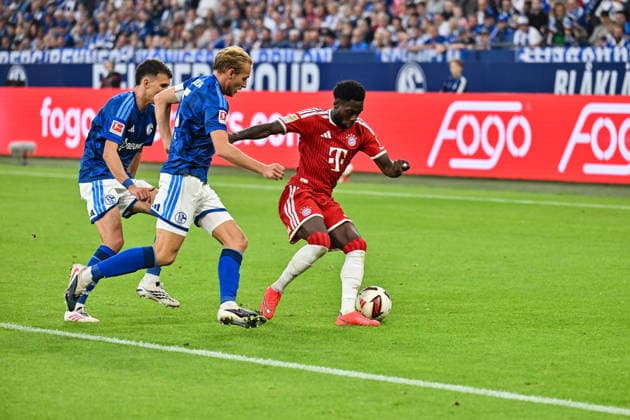 GELSENKIRCHEN, GERMANY; 05. SEPTEMBER: tackle between Alphonso DAVIES (FC Bayern Munich 19), Timo BECKER (FC Schalke 5) and Dejan LJUBICIC (FC Schalke 21 during the Bundesliga Match between FC Schalke 04 vs. FC Bayern Munich at Matchday 2 at Veltins Arena DFL REGULATIONS PROHIBIT ANY USE OF PHOTOGRAPHS AS IMAGE SEQUENCES AND OR QUASI-VIDEO Copyright: xBEAUTIFULxSPORTS Goldbergx