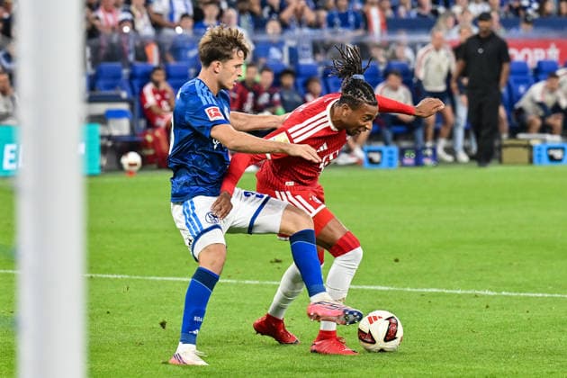 gELSENKIRCHEN, GERMANY; 05. SEPTEMBER: tackle between Vitalie BECKER (FC Schalke 33) and Michael OLISE (FC Bayern Munich 17) during the Bundesliga Match between FC Schalke 04 vs. FC Bayern Munich at Matchday 2 at Veltins Arena DFL REGULATIONS PROHIBIT ANY USE OF PHOTOGRAPHS AS IMAGE SEQUENCES AND OR QUASI-VIDEO Copyright: xBEAUTIFULxSPORTS Goldbergx