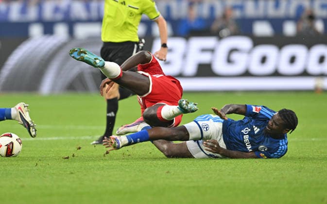 (l-r) Eric Dina-Ebimbe (FC Schalke 04) foult Dayot Upamecano (Bayern München) Foul, Aktion, Zweikampf, Fussball 1. Bundesliga, 2.Spieltag, FC Schalke 04 - FC Bayern München 0:0, am 05.09.2026 in Gelsenkirchen Deutschland. DFL regulations prohibit any use of photographs as image sequences and or quasi-video Â *** l r Eric Dina Ebimbe (FC Schalke 04) fouls Dayot Upamecano (Bayern Munich) — Foul, Action, Tackle, Soccer, 1. Bundesliga, Matchday 2, FC Schalke 04 vs. FC Bayern Munich 0–0, on September 5, 2026, in Gelsenkirchen, Germany. DFL regulations prohibit any use of photographs as image sequences and or quasi-video.