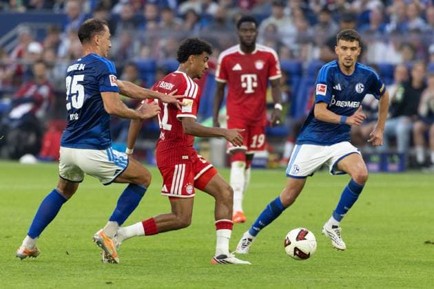 (260906) -- GELSENKIRCHEN, Sept. 6, 2026 -- Dejan Ljubicic (R) and Nikola Katic (L) of FC Schalke 04 vie with Nathaniel Brown of FC Bayern Munich during the German first division Bundesliga football match between FC Schalke 04 and FC Bayern Munich in Gelsenkirchen, Germany, Sept. 5, 2026. (Photo by Xinhua) (SP)GERMANY-GELSENKIRCHEN-FOOTBALL-BUNDESLIGA-SCHALKE 04 VS BAYERN MUNICH JoachimxBywaletz 