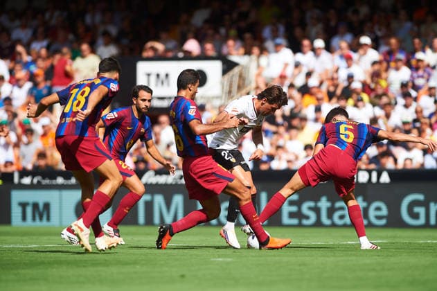 Rodrigo Hernandez FC Barcelona, Barca and Jesus Vazquez (Valencia CF) during the LaLiga EA Sports match between Valencia CF and FC Barcelona at Mestalla on September 6, 2026 in Valencia, Spain. -