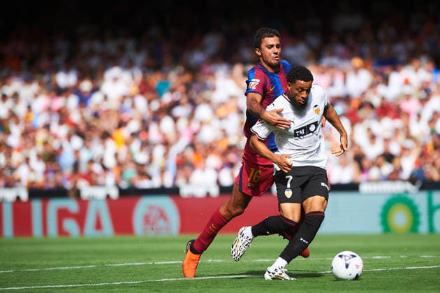 Rodrigo Hernandez FC Barcelona, Barca and Arnaut Danjuma (Valencia CF) during the LaLiga EA Sports match between Valencia CF and FC Barcelona at Mestalla on September 6, 2026 in Valencia, Spain. -