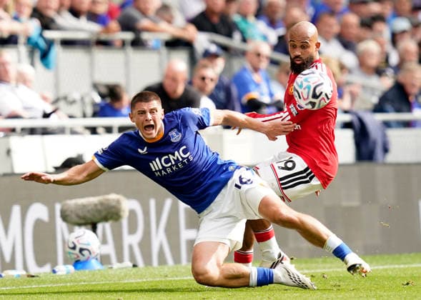 Liverpool, England, 6th September 2026. Bryan Mbeumo of Manchester United, ManU (R) challenges Vitaliy Mykolenko of Everton during the Everton vs Manchester United Premier League match at Hill Dickinson Stadium, Liverpool. Picture credit should read: Andrew Yates Sportimage EDITORIAL USE ONLY. No use with unauthorised audio, video, data, fixture lists, club league logos or live services. Online in-match use limited to 120 images, no video emulation. No use in betting, games or single club league player publications. SPI_036_AY_EVERTON_MAN_UTD SPI-4979-0036