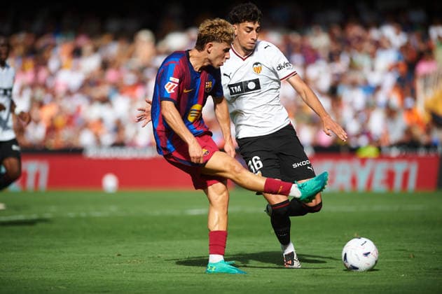 Fermin Lopez FC Barcelona, Barca and Iker Cordoba (Valencia CF) during the LaLiga EA Sports match between Valencia CF and FC Barcelona at Mestalla on September 6, 2026 in Valencia, Spain. -