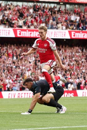 London, England, 6th September 2026. Martin Odegaard of Arsenal scoring and celebrating his sides second goal during the Arsenal vs Chelsea Premier League match at the Emirates Stadium, London. Picture credit should read: David Klein Sportimage EDITORIAL USE ONLY. No use with unauthorised audio, video, data, fixture lists, club league logos or live services. Online in-match use limited to 120 images, no video emulation. No use in betting, games or single club league player publications. SPI_044_DK_Arsenal_Chelsea SPI-4978-0044