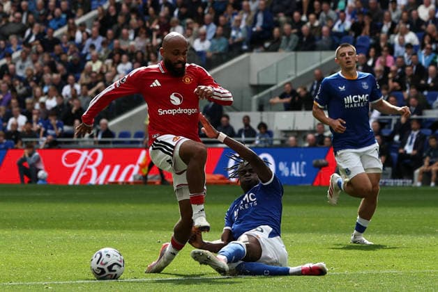 6th September 2026; Hill Dickinson Stadium, Liverpool, England; Premier League Football, Everton versus Manchester United, ManU Tyrique George of Everton slides in to tackle Bryan Mbuemo of Manchester United DavidxBlunsden