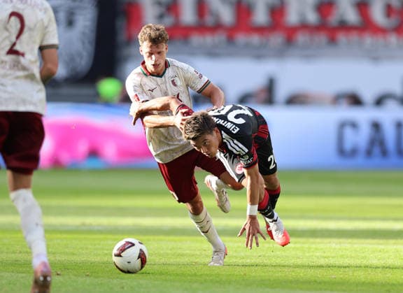 06.09.2026, Fussball Bundesliga, Eintracht Frankfurt - FC Augsburg, v.l., Robin Fellhauer (FC Augsburg), Ritsu Doan (Eintracht Frankfurt) DFL DFB REGULATIONS PROHIBIT ANY USE OF PHOTOGRAPHS AS IMAGE SEQUENCES AND OR QUASI-VIDEO. xdcx *** September 6, 2026, Soccer Bundesliga, Eintracht Frankfurt vs. FC Augsburg, from left, Robin Fellhauer (FC Augsburg) and Ritsu Doan (Eintracht Frankfurt). DFL and DFB regulations prohibit any use of photographs as image sequences and or quasi-video. xdcx Copyright: HMBxMedia Claus