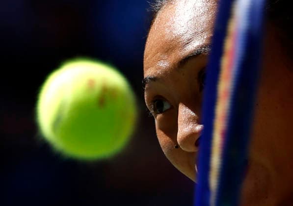 Qinwen Zheng of China returns a ball to Iga.Swiatek of Poland before defeating her in straight sets in the 4th round in Arthur Ashe Stadium at the 2026 US Open Tennis Championship at the USTA Billie Jean King National Tennis Center in New York City on Monday, September 7, 2026.  NYP20260907110 JOHNxANGELILLO