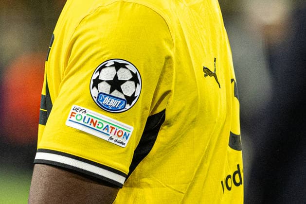 UEFA Champions League: Borussia Dortmund - Villarreal CF; 08.09.2026 The first ever UEFA Champions League Debut Patch auf dem Trikot von Borussia Dortmund. UEFA Champions League Auftakt: Borussia Dortmund - Villarreal CF; BVB Stadion Dortmund, Dortmund; 08.09.2026 Copyright: xBEAUTIFULxSPORTS Buriakovx